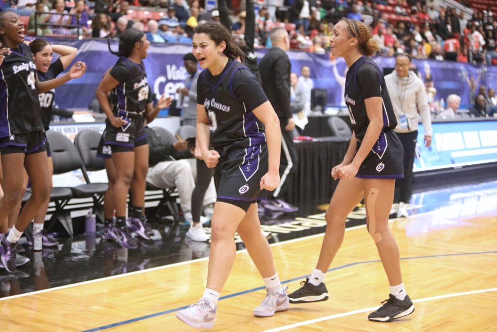 Gainesville's Jamison Cardwell (0) and Jayden Terry (11) celebrate in the closing seconds of a 54-52 win against Northeast (Oakland Park) in the Class 5A state semifinals. Photo by C.J. Gish