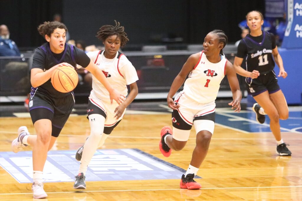 Gainesville's Jamison Cardwell (0) brings the ball down the court against Northeast (Oakland Park) in the Class 5A state semifinals. Photo by C.J. Gish