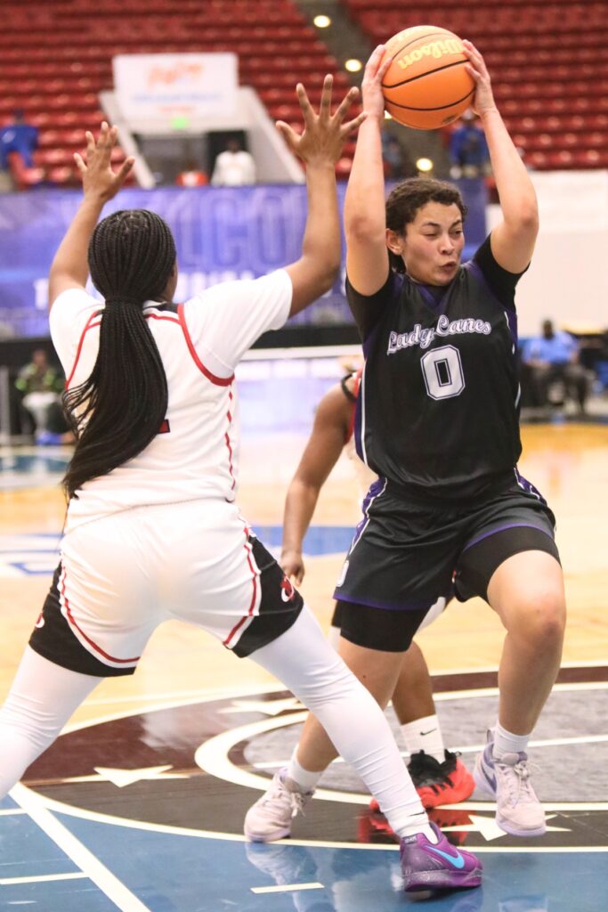 Gainesville's Jamison Cardwell (0) drives to the basket against Northeast (Oakland Park) in the Class 5A state semifinals. Photo by C.J. Gish