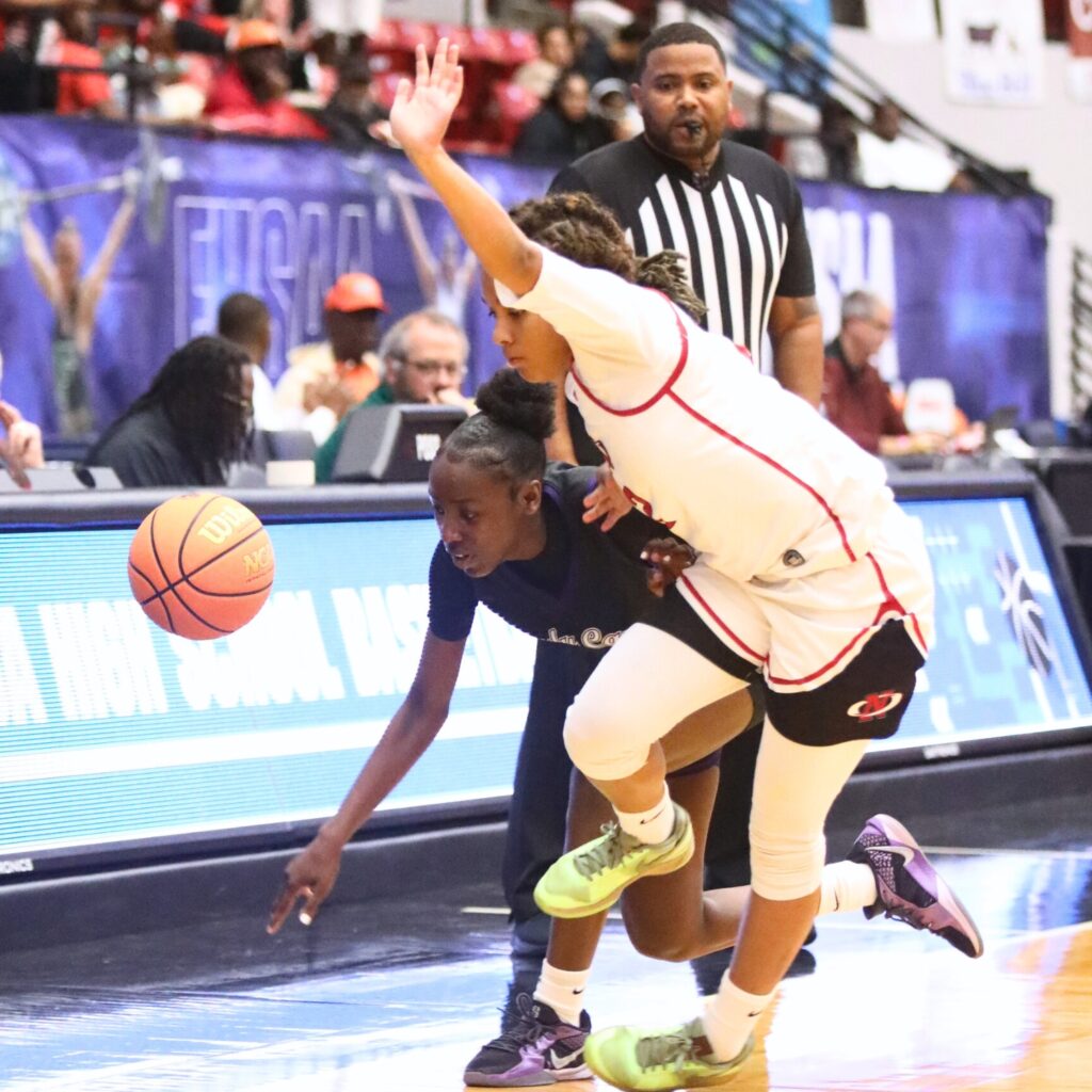 Gainesville's Kendall Ruise (4) gets fouled as she brings the ball downcourt against Northeast (Oakland Park) in the Class 5A state semifinals. Photo by C.J. Gish
