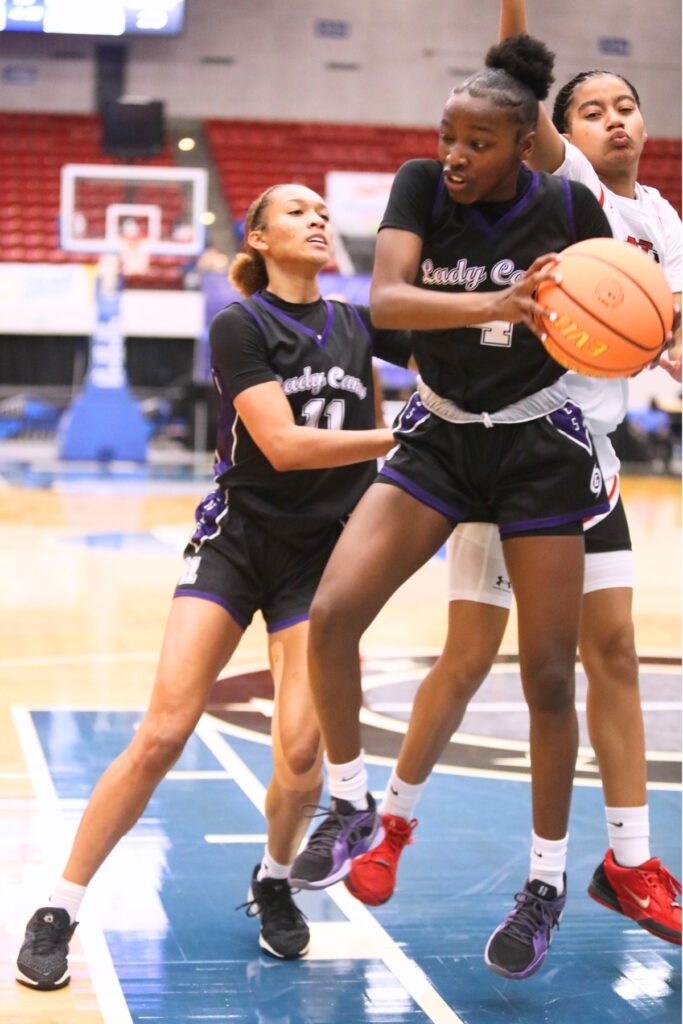 Gainesville's Kendall Ruise (4) with a rebound against Northeast (Oakland Park) in the Class 5A state semifinals. Photo by C.J. Gish