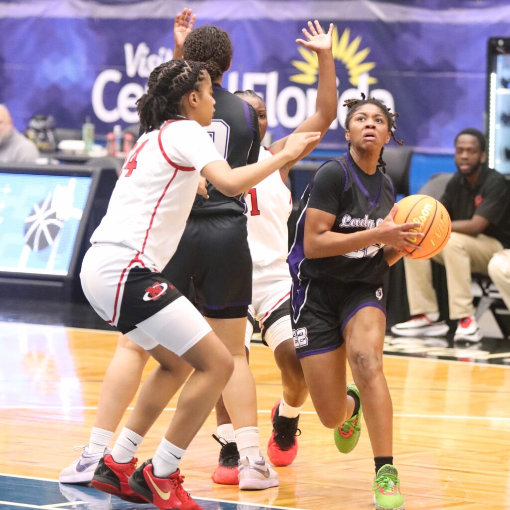 Gainesville's Mayah Gordon (22) drives to the basket against Northeast (Oakland Park) in the Class 5A state semifinals. Photo by C.J. Gish