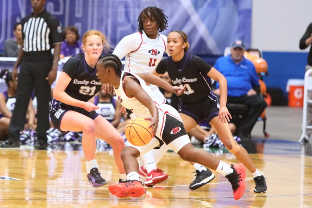 Gainesville's Sarah Collins (21) and Jayden Terry (11) on defense against Northeast (Oakland Park) in the Class 5A state semifinals. Photo by C.J. Gish
