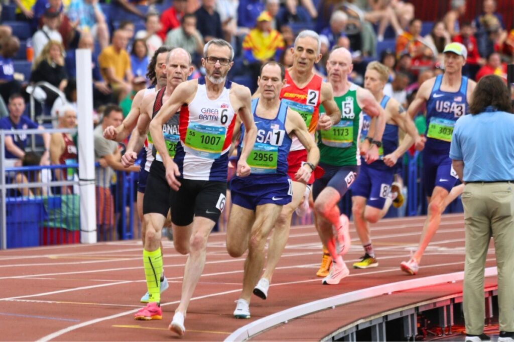 Great Britain's Mark Symes leads the 800-meter race for a heat in the men 55-60 years old section. Photo by Seth Johnson