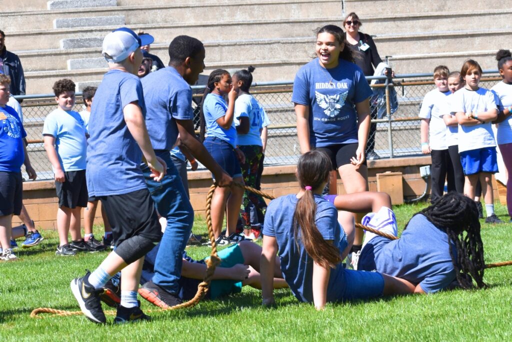 Hidden Oak Elementary students celebrate after winning a round of Tug of War. Photo by Glory Reitz