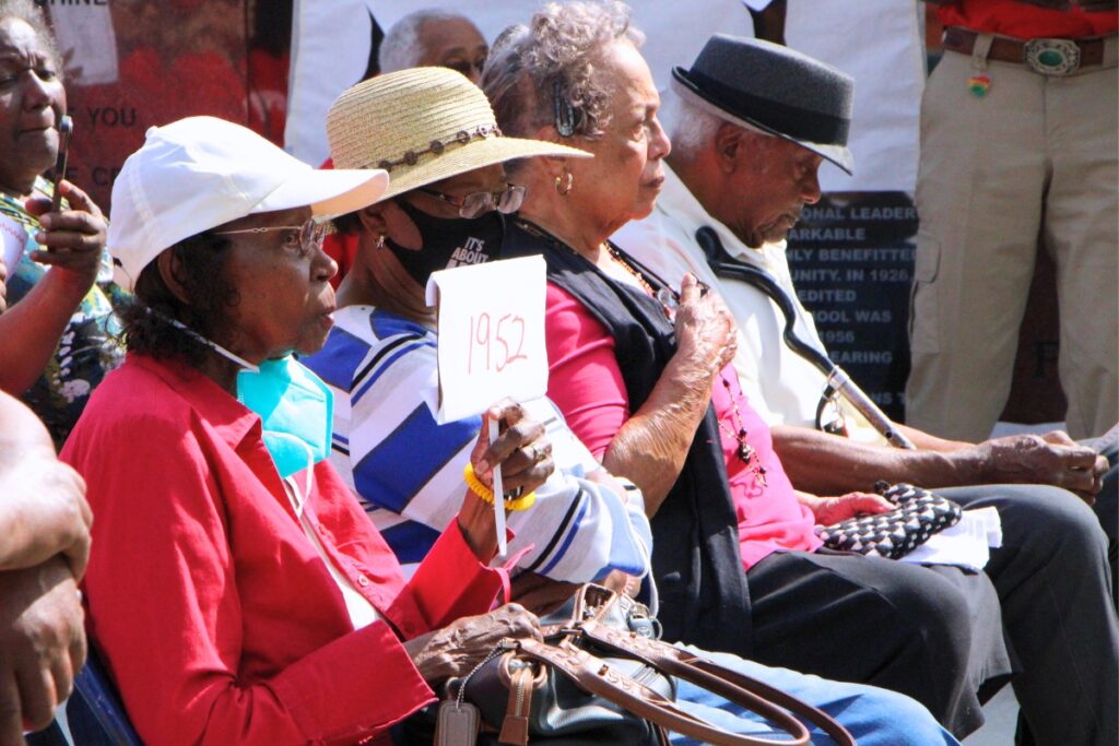 LHS graduate from 1952 in the crowd of the memorial wall unveiling. Photo by Lillian Hamman