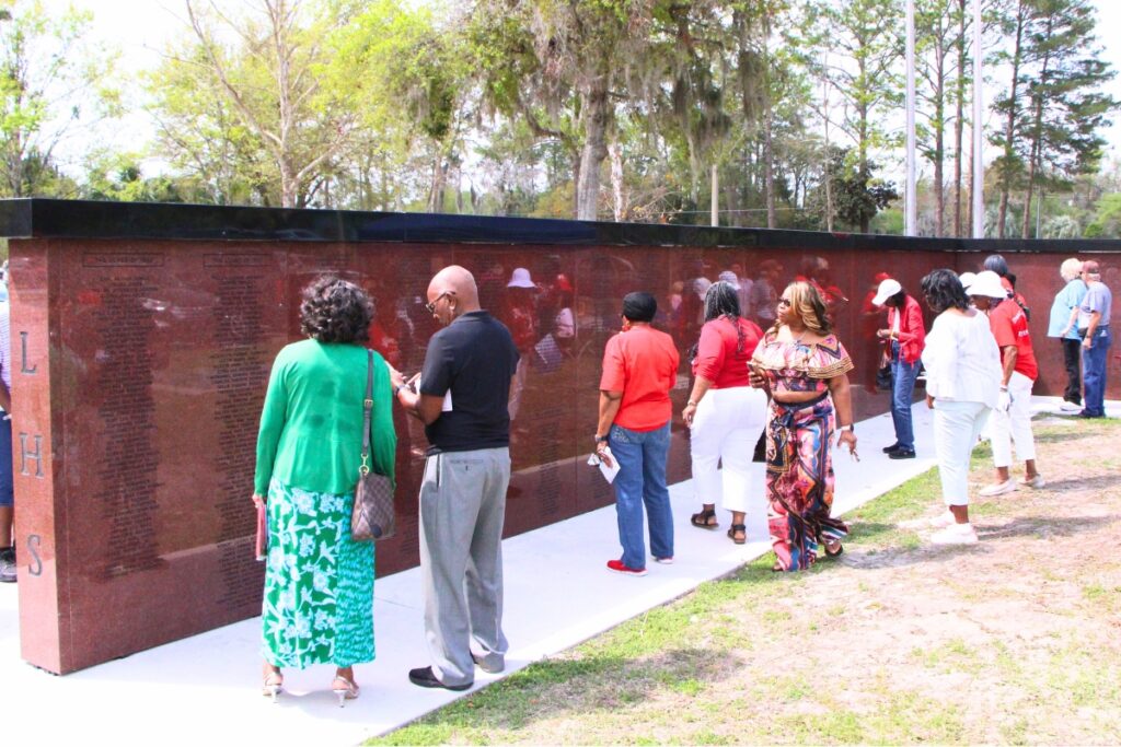 Lincoln High School Memorial Wall attendees find their names and names of loved ones etched in the granite. Photo by Lillian Hamman