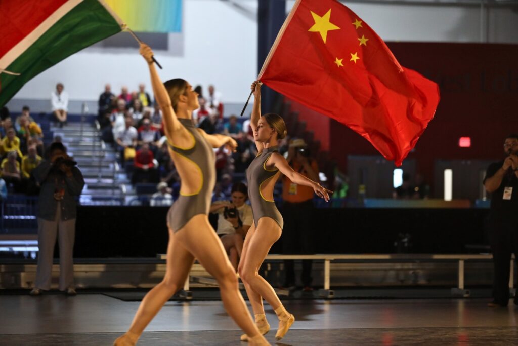 Members of Dance Alive National Ballot perform with flags during the opening ceremony. 