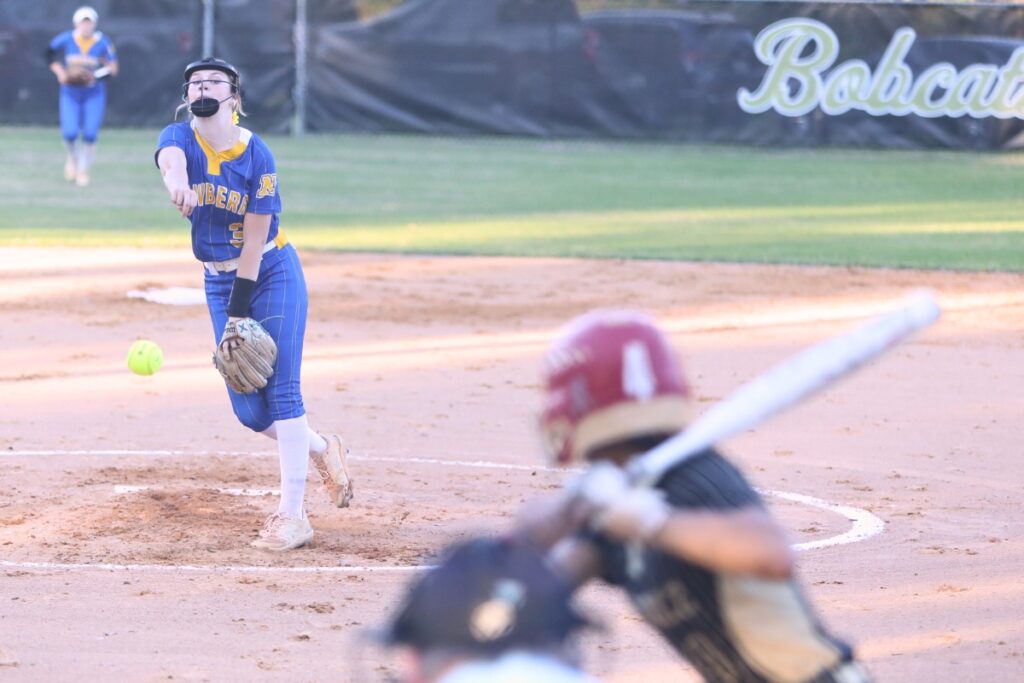 Newbery's Madison Rodgers (3) pitches to Buchholz's Jordyn Cooper (4). Photo by C.J. Gish