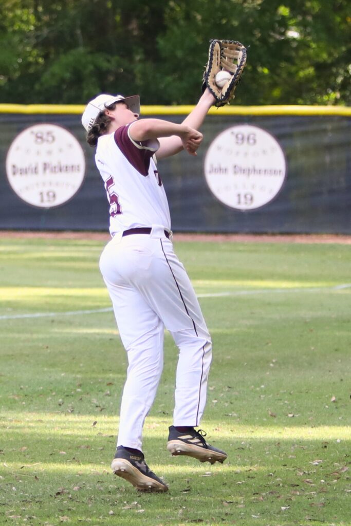 Oak Hall's McNeil Ezzell with a second-inning catch in foul territory against Hawthorne. Photo by C.J. Gish