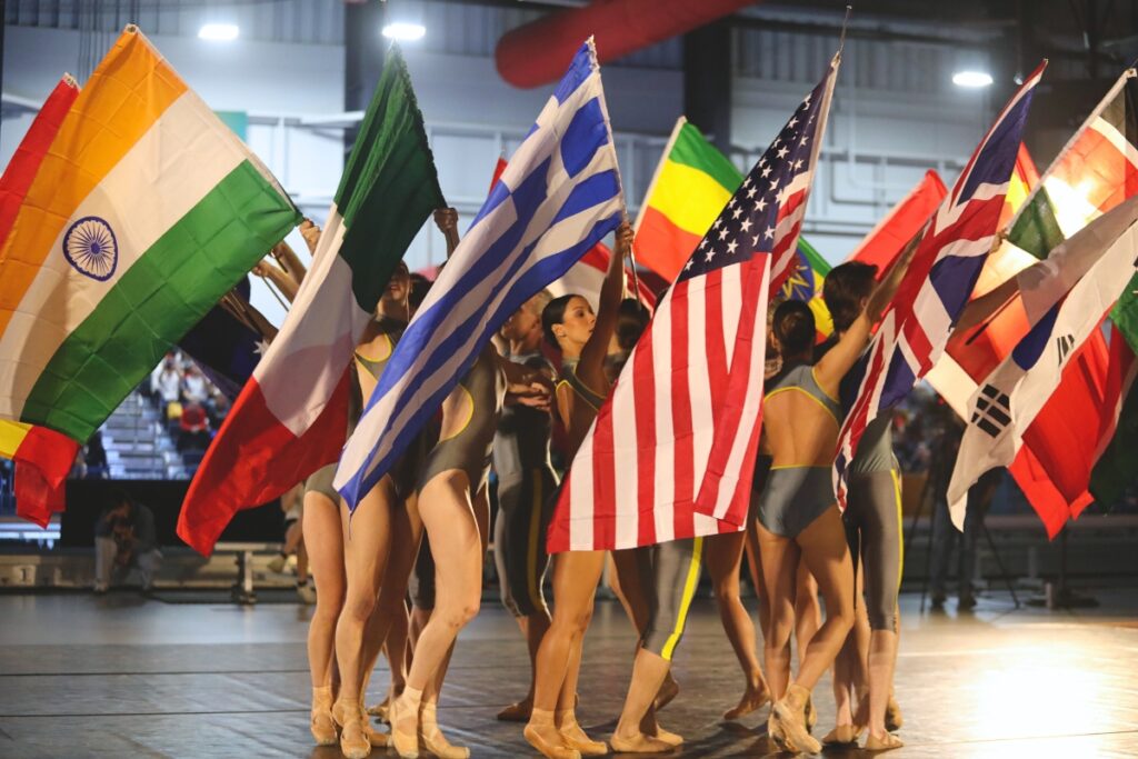 Performers for Dance Alive National Ballet perform with different nations' flags during the opening ceremony for the 2025 World Masters Athletics Indoor Championships. 