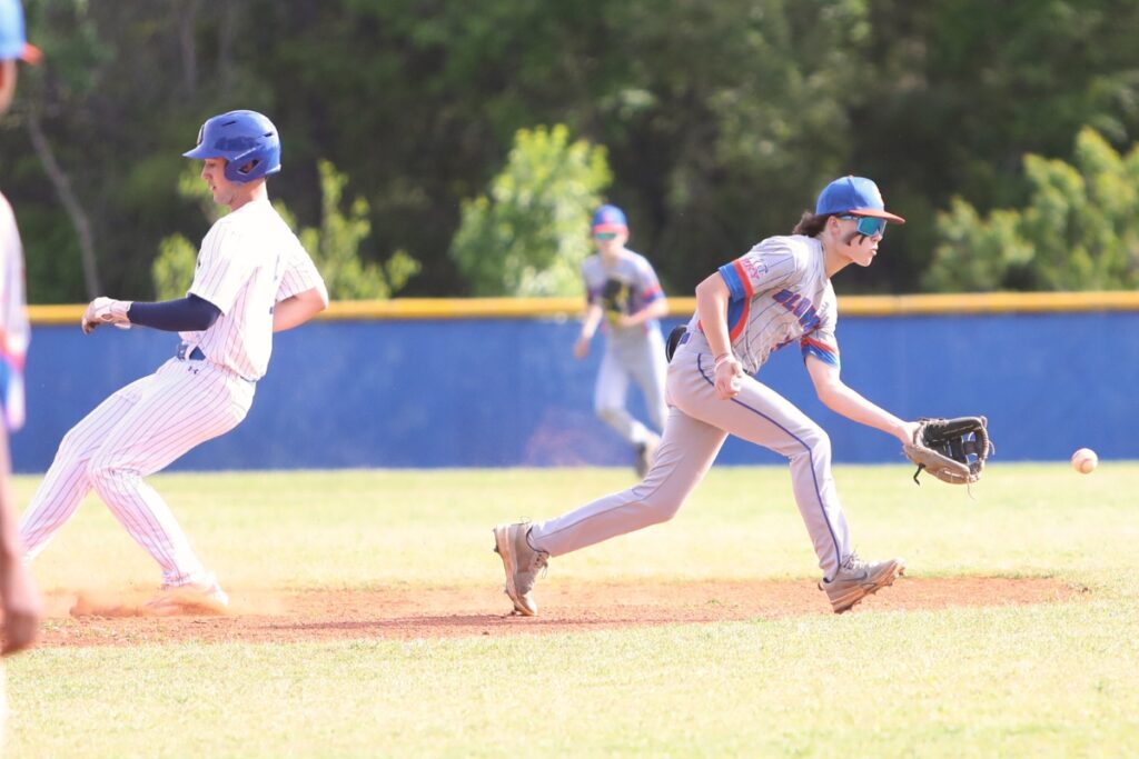 St. Francis Catholic's Nate Muir steals second base against P.K. Yonge. Photo by C.J. Gish