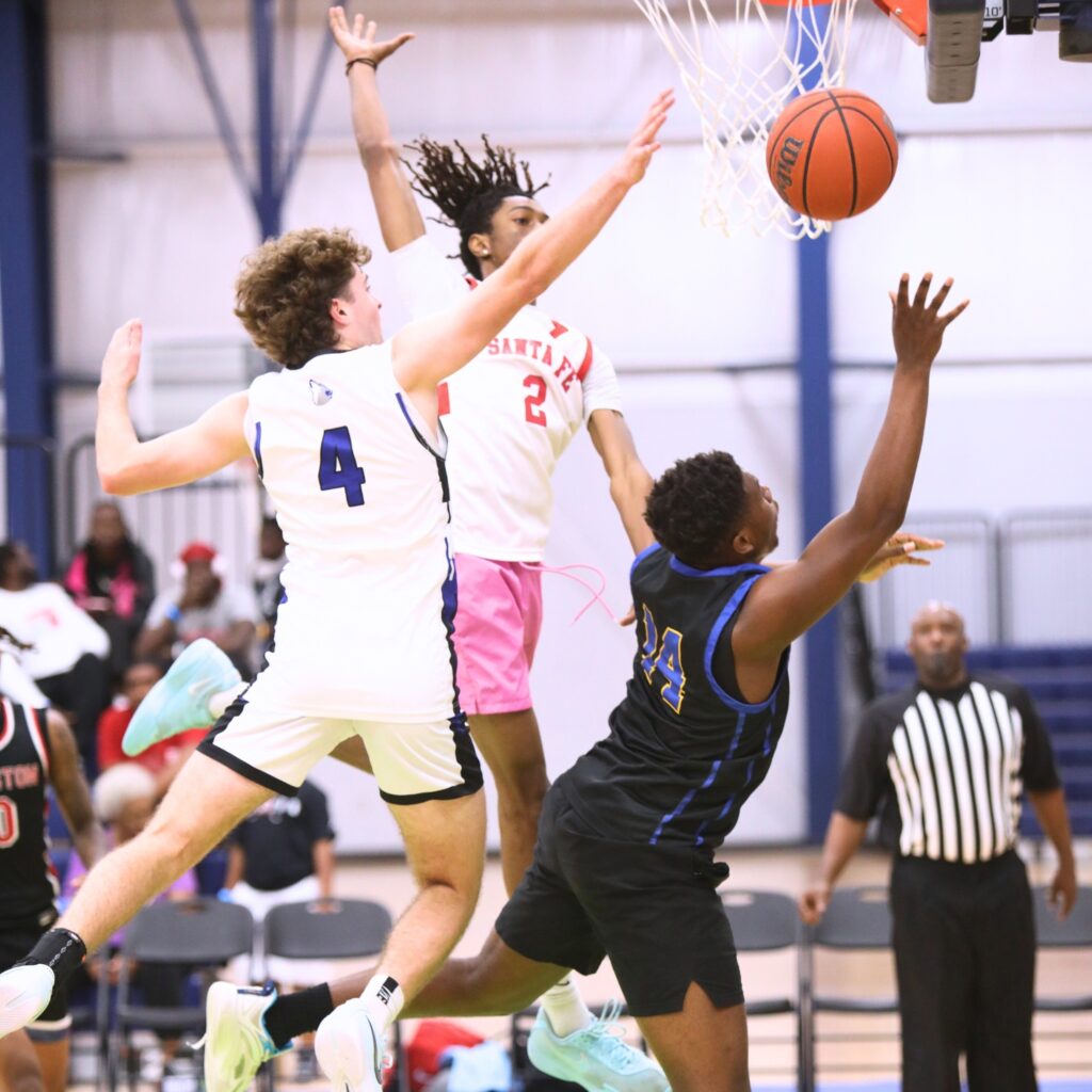 St. Francis Catholic's William Collett (4) and Santa Fe's Cedric Collins (2) attempt to block a shot by Newberry's Dyllan Strappy (14) at The Prep Zone All-Star Showcase. Photo by C.J. Gish 1 (1)