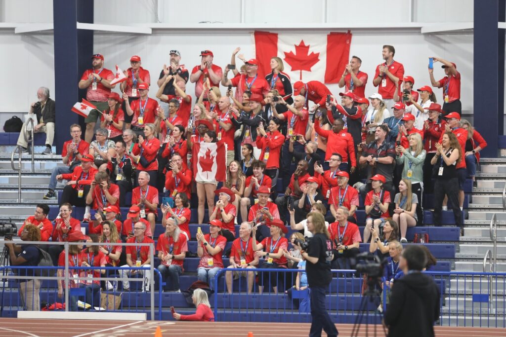 Team Canada celebrates as its flag enters the Parade of Nations. 