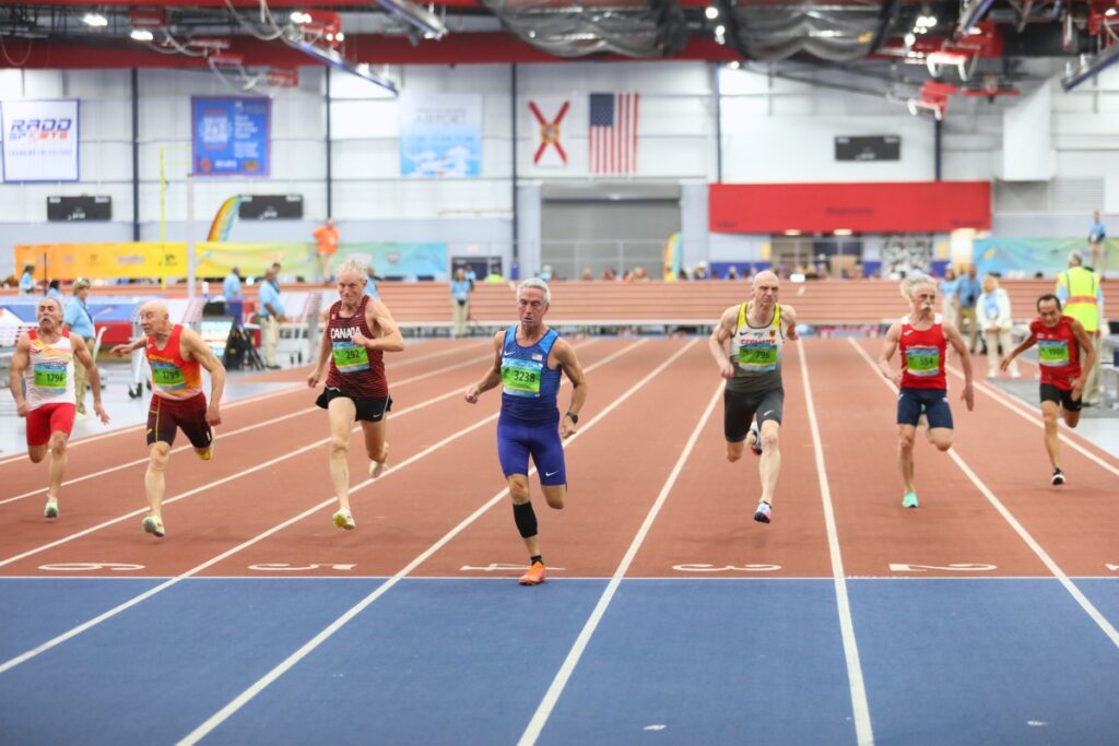Team USA's Ron Stevens wins his heat in the 60-meter dash. Photo by Seth Johnson