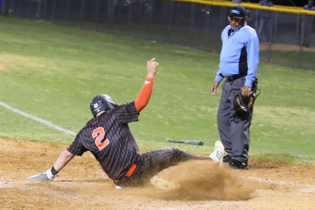 Trenton's Jordan Marlo (2) scores a run against Union County in the fourth inning.