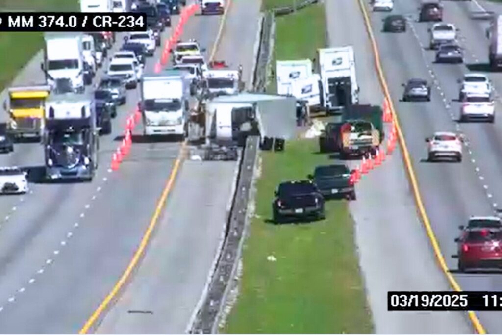 Two people were injured when a U.S. Postal Service (USPS) tractor-trailer collided with a pickup stopped and partially blocked the outside lane on southbound Interstate 75 early Wednesday morning