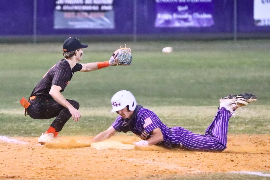 Union County's Jeffrey Brugh steals third base against Trenton. Photo by C.J. Gish