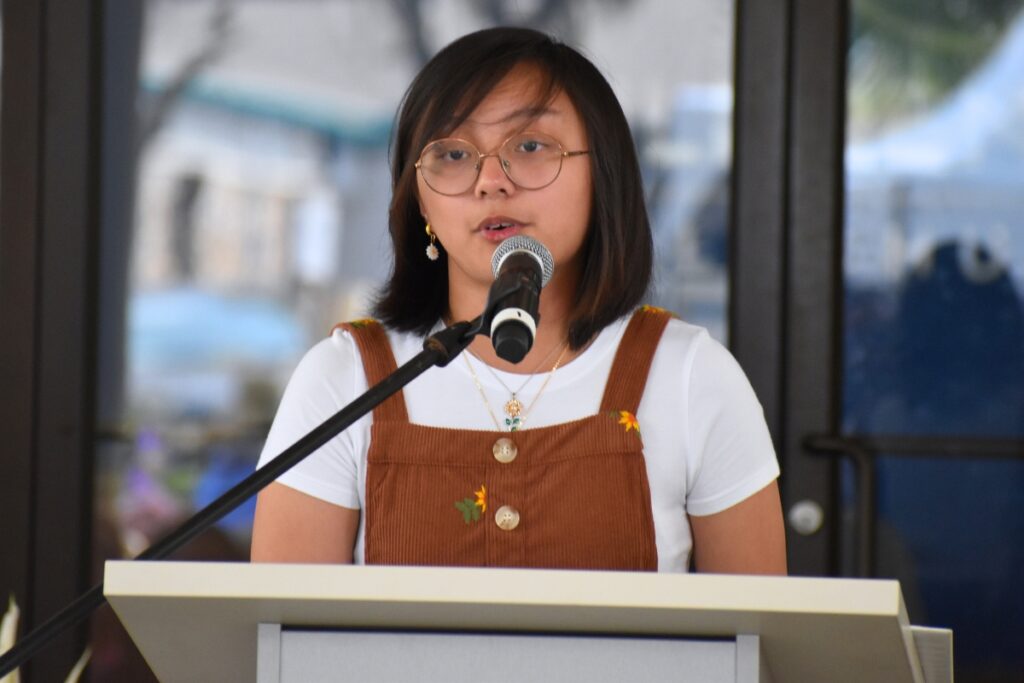 Youth Poet Laureate Annika Gamad reads her poem, Trust in the Children. Photo by Glory Reitz