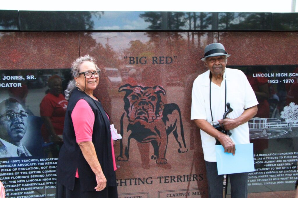 Yvonne and Jesse Heard stand for pictures with the finished LHS Memorial Wall. Photo by Lillian Hamman