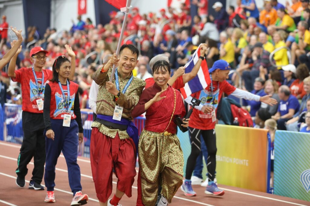 Team Thailand makes its way around the Jimmy Carnes Track during the Parade of Nations at Saturday's opening ceremony of the World Masters Athletics Indoor Championships. 