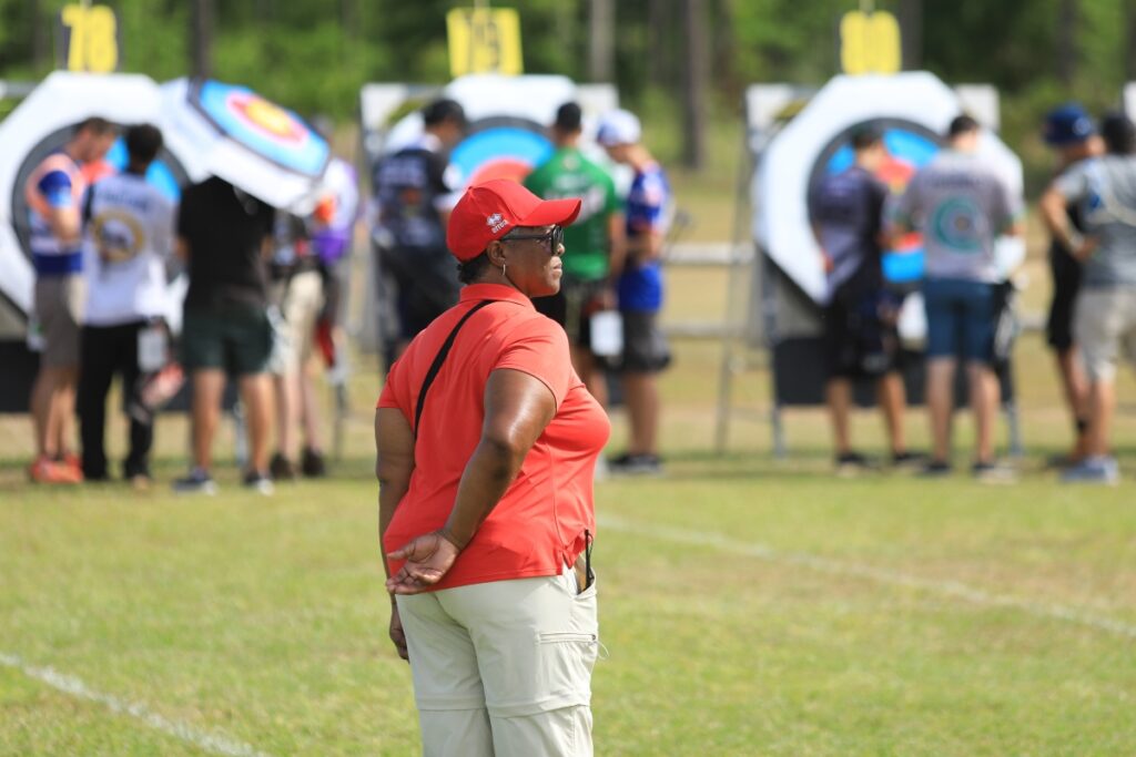 A judge watches as archers score their marks during qualifying. 