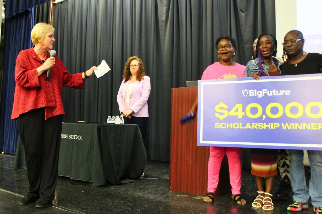 ACPS interim superintendent Kamela Patton congratulates Melody Watson (second from right) on the College Board scholarship win. Photo by Lillian Hamman
