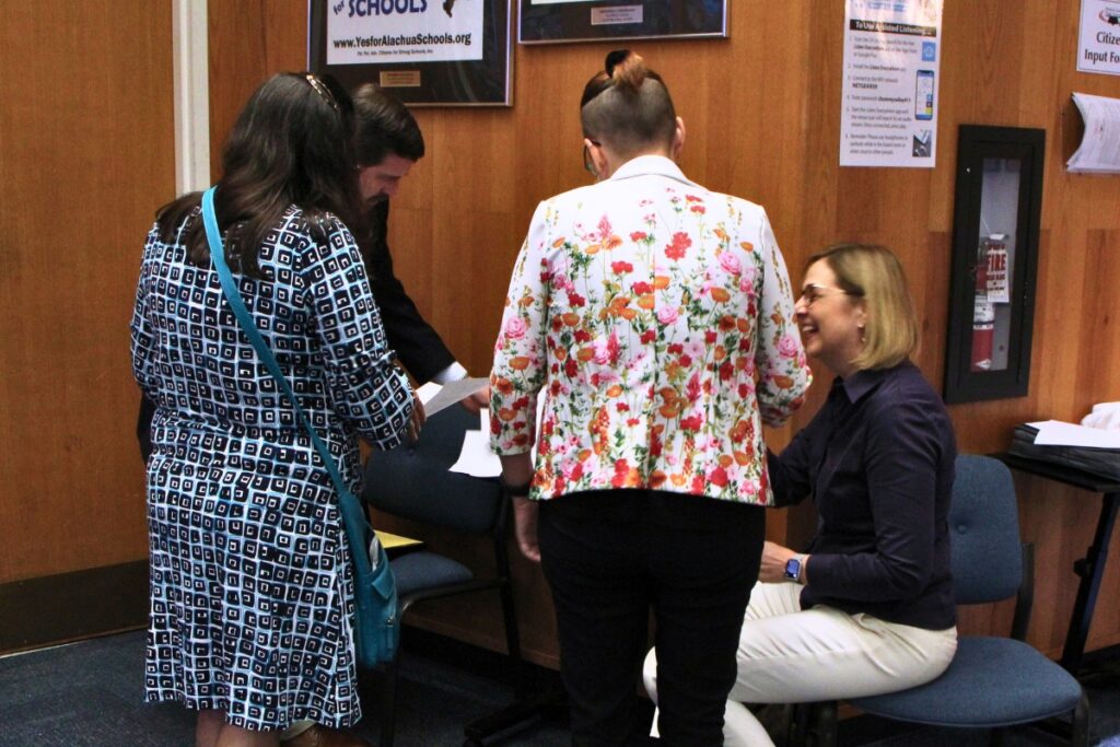 Alachua County Education Association and Alachua County School District staff sign memorandum of understandings following the ratification of agreement amendments. Photo by Lillian Hamman
