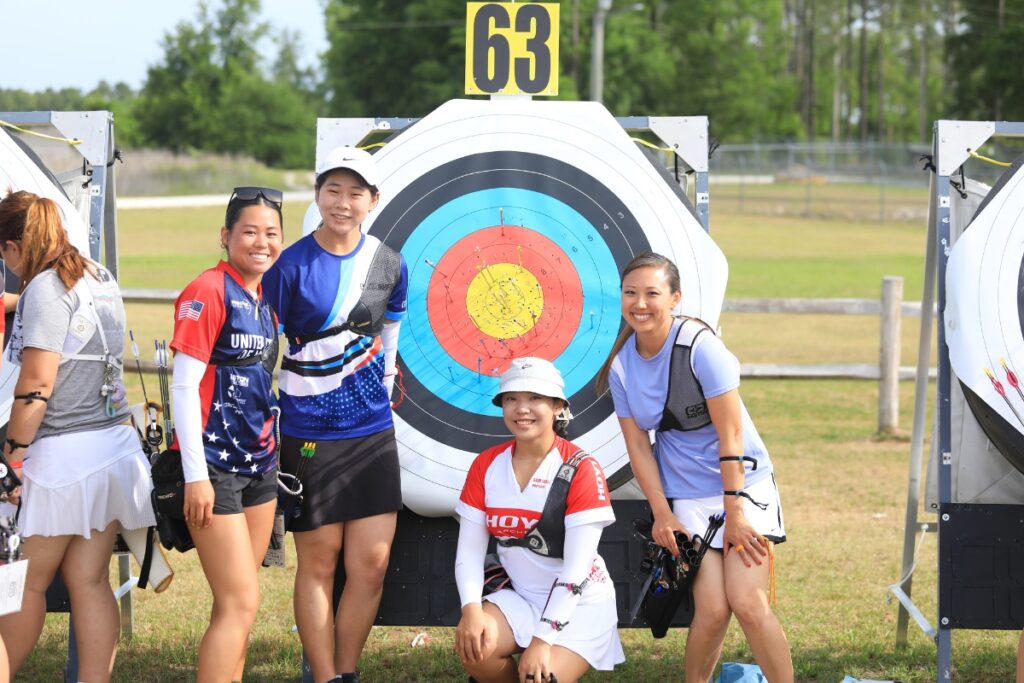 Archers at target 63 (Sarah Schildknecht, Cham Chung, Gabrielle Sasai and Riley Tateyama) take a quick break from counting scores. 