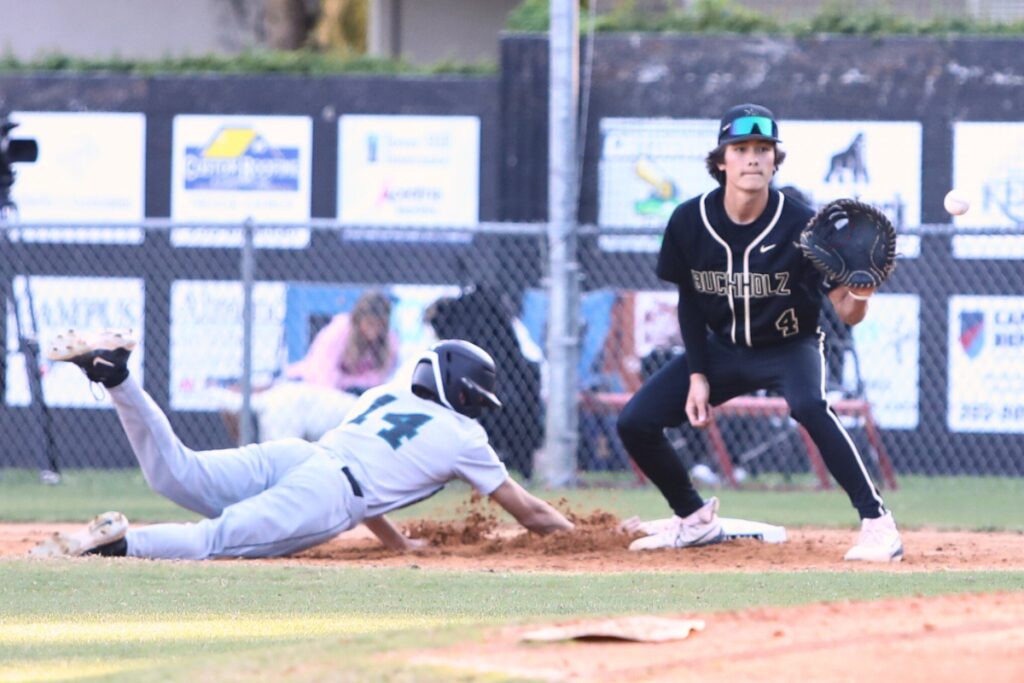Buchholz's Aidan Kastensmidt (2) with a pickoff throw to Zac Brown (4) at first base against Providence (Jacksonville). Photo by C.J. Gish