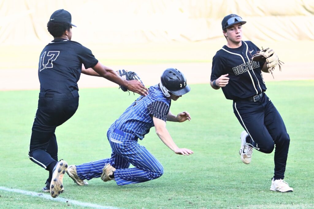 Buchholz's Dion Wilborn gets the third out on a rundown in the first inning against First Coast (Jacksonville) in game two of the 6A Region 1 Quarterfinals. Photo by C.J. Gish