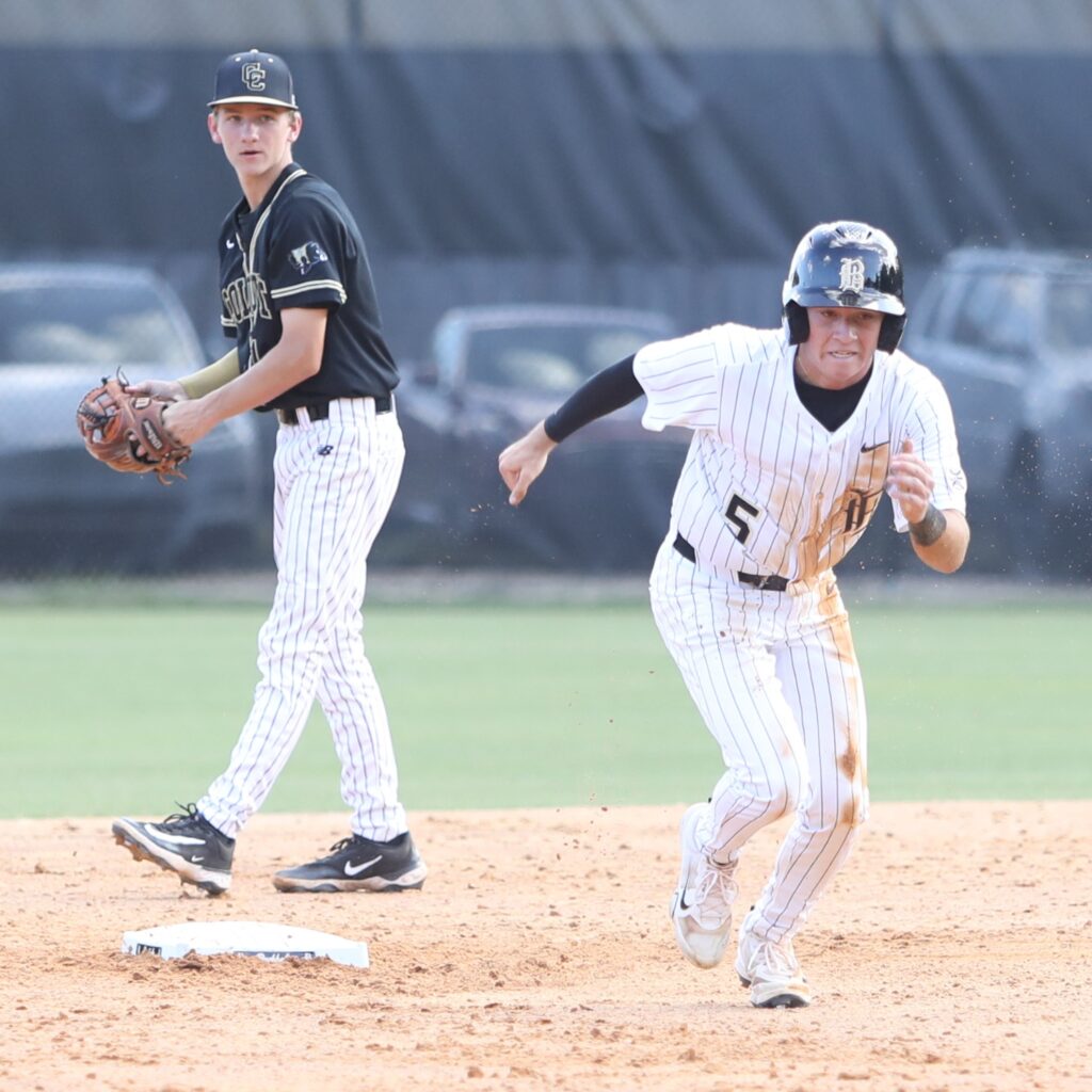 Buchholz's Roen Kresak (5) takes off for third base in the first inning against Colquitt County. Photo by C.J. Gish