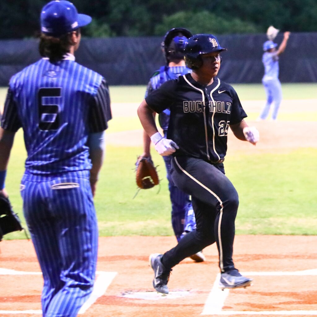 Buchholz's Stuart Ding (25) scores to put the Bobcats ahead 7-2 in the fifth inning against First Coast (Jacksonville) in game two of the 6A Region 1 Quarterfinals. Photo by C.J. Gish