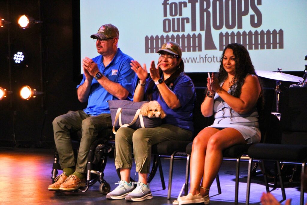Carlos Rivera (left) and his wife (middle), daughter and dog Chiquita. Photo by Lillian Hamman