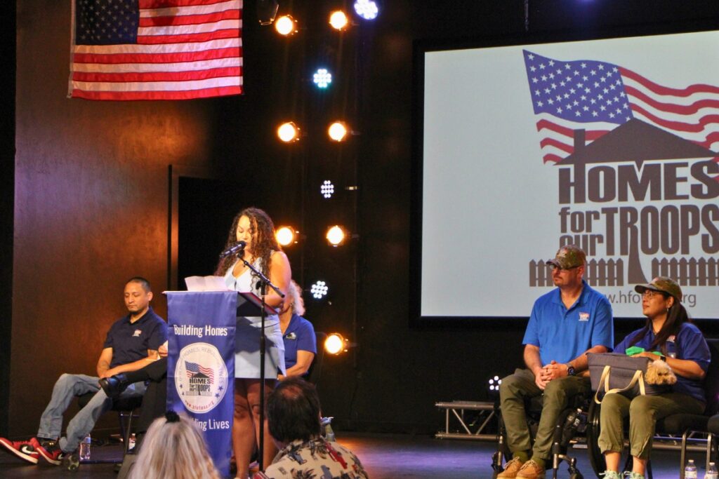Carlos Rivera's daughter, Dr. Stephanie Rivera Velasquez, speaks of HFOT ceremony. Photo by Lillian Hamman