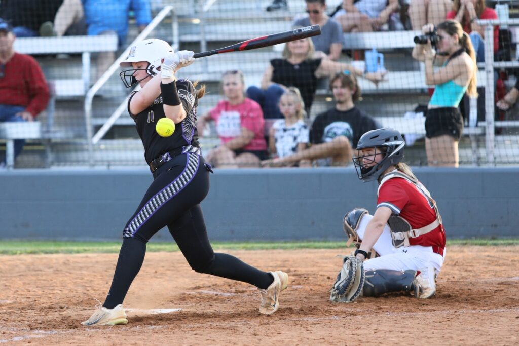 Columbia's Kimber Long hits a ball into foul territory against Santa Fe. Photo by C.J. Gish 1