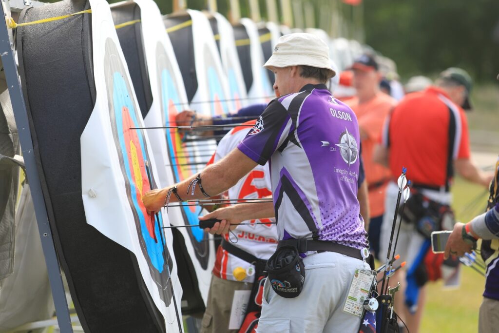 Florida's Erik Olson removes his arrows after a qualifying round. 