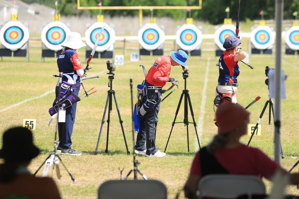 From left, Alison Lincoln, Candice Raines, and Janis Grellner shoot during Saturday's qualifying for recurve 50+ women. Greller would go on to win the division on Sunday. 