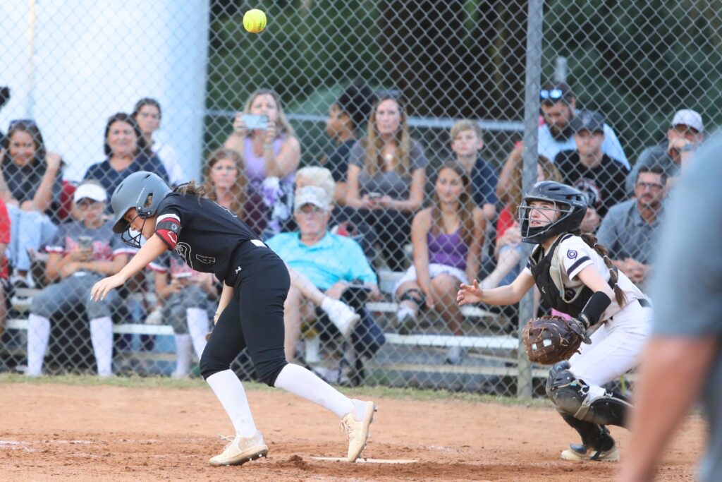 Gainesville catcher Roxanne Walsh catches a pop-up bunt by Santa Fe's Reagan Saucier for an out. Photo by C.J. Gish