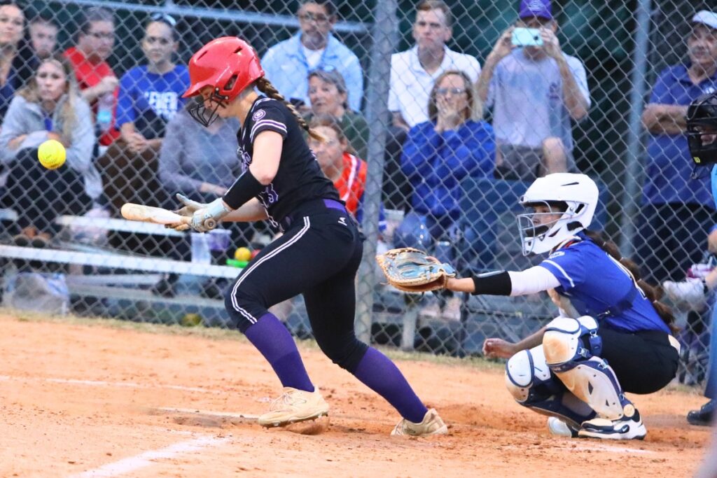 Gainesville's Emma Barton (3) with a fourth inning bunt against Belleview in the 5A District 5 Semifinals. Photo by C.J. Gish