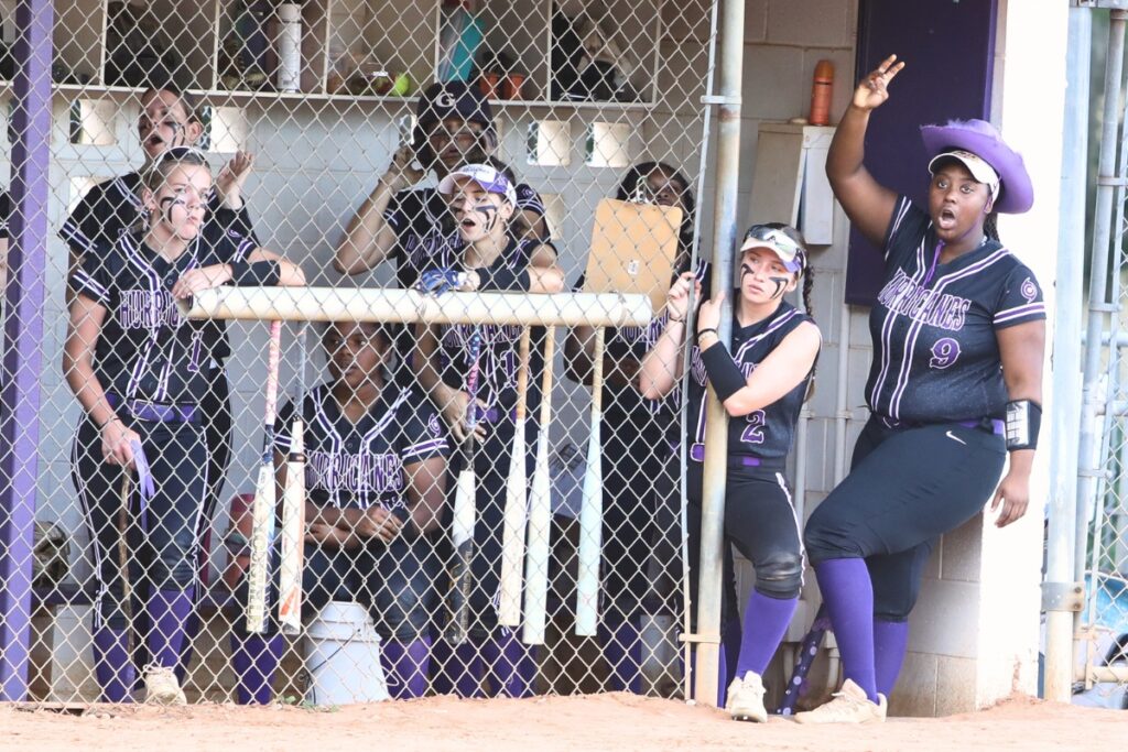 Gainesville's Rihanna Williams (9) and the Hurricane's dugout cheer on the team while at-bat against Belleview in the 5A District 5 Semifinals. Photo by C.J. Gish