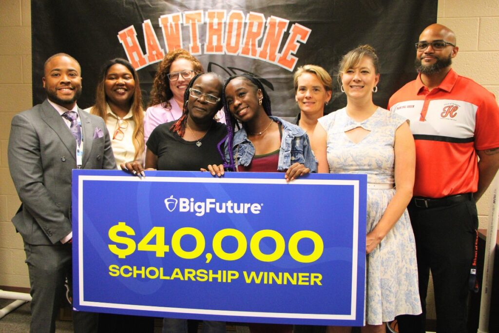 Hawthorne High School's Melody Watson (in jacket) celebrates after receiving the College Board $40,000 scholarship win. Photo by Lillian Hamman
