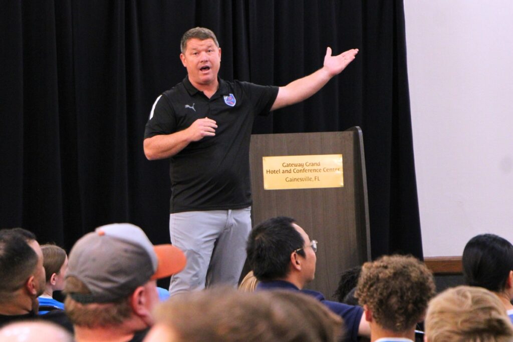 Jeremy Witt of Gainesville Soccer Academy addresses players, coaches and parents at town hall meeting. Photo by Lillian Hamman