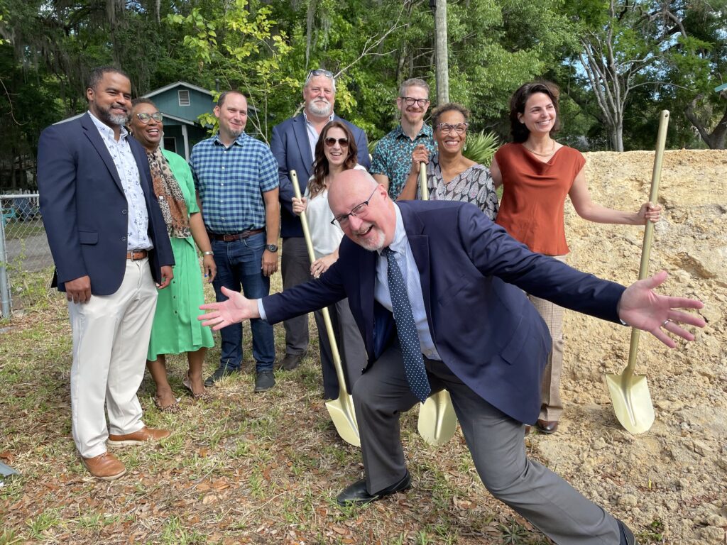 Mayor Harvey Ward drops into a photo with Gainesville planning staff and city leaders. Photo by Seth Johnson
