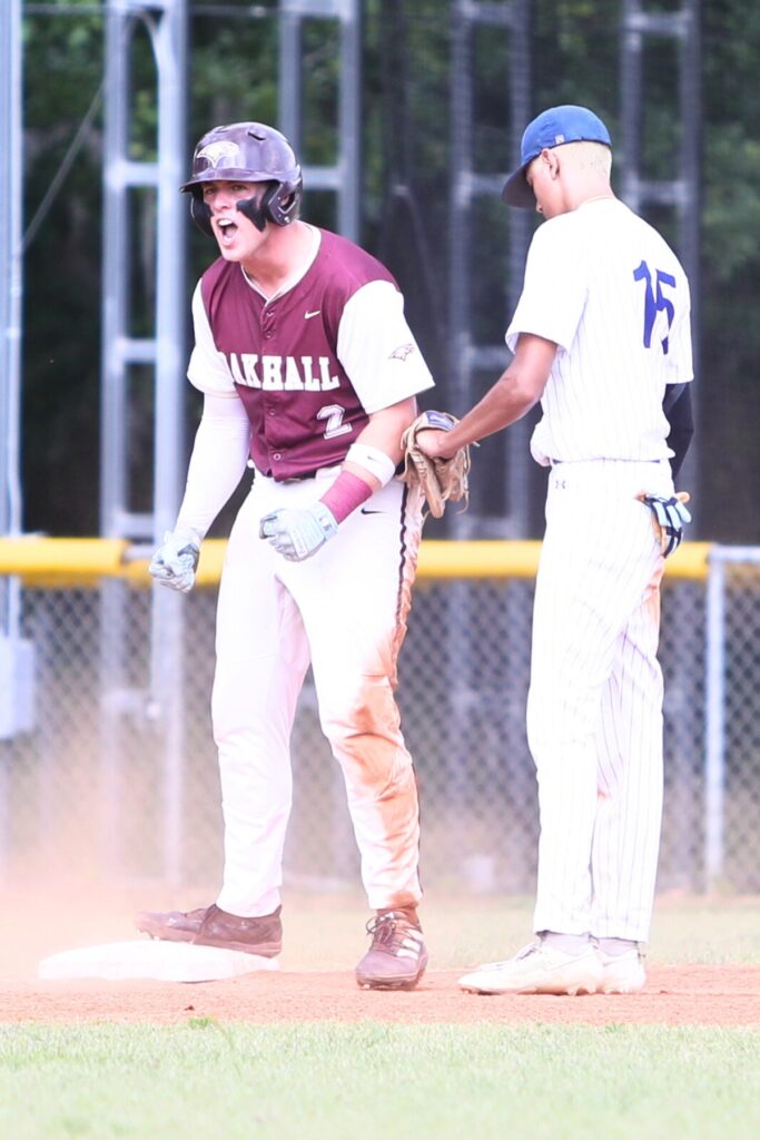 Oak Hall's Gavin Jones (4) celebrates after hitting a two-run triple to put the Eagles ahead 5-0 in the second inning against St. Francis Catholic in game two of the 1A Regional quarterfinals. Pho