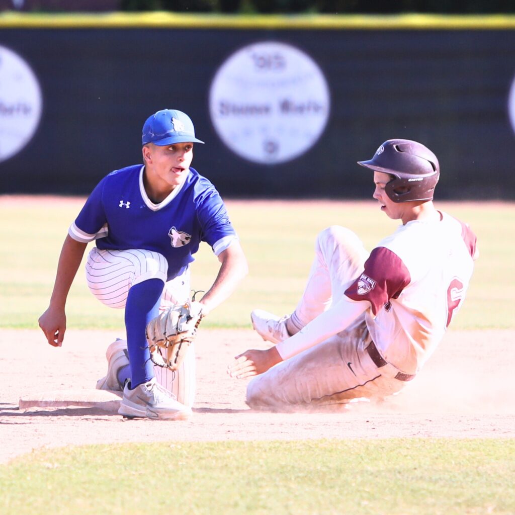 Oak Hall's Lincoln Jones slides safely to second base against St. Francis Catholic in sixth inning in the Class 1A-District 5 championship game. Photo by C.J. Gish