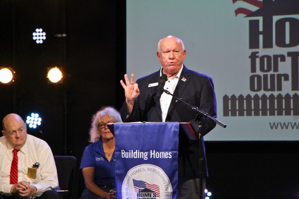 Retired Brig. Gen. and HFOT President and CEO Tom Landwermeyer introduces veteran Carlos Rivera. Photo by Lillian Hamman