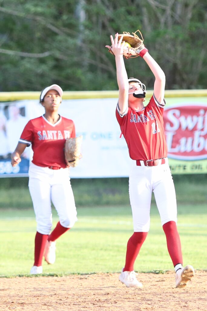 Santa Fe's Juliana Mott (11) catches an infield pop-up for the third out in the bottom of the first inning. Photo by C.J. Gish
