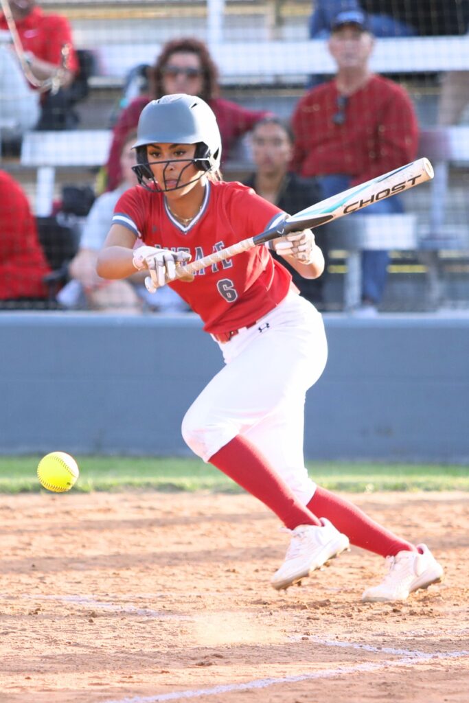 Santa Fe's Madisen Crosby with a bunt against Columbia. Photo by C.J. Gish