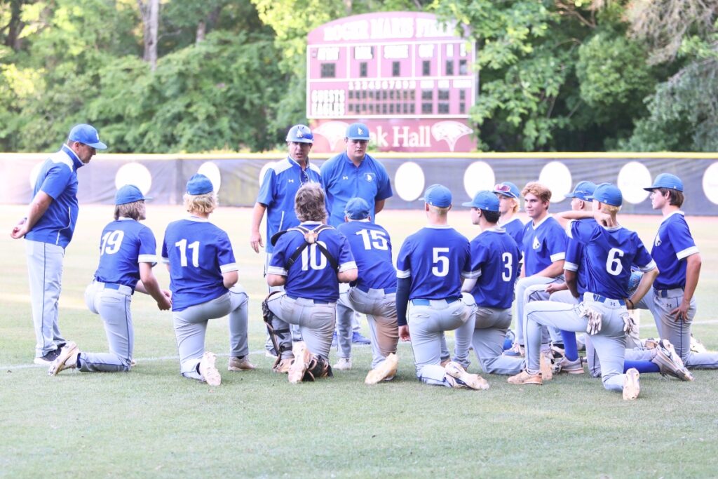 St. Francis Catholic coach Ryan Brown talks to his team after winning game three of the 1A Region 2 Quarterfinals at Oak Hall. Photo by C.J. Gish